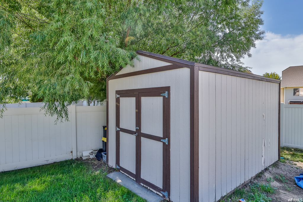 View of outdoor structure with a storage shed