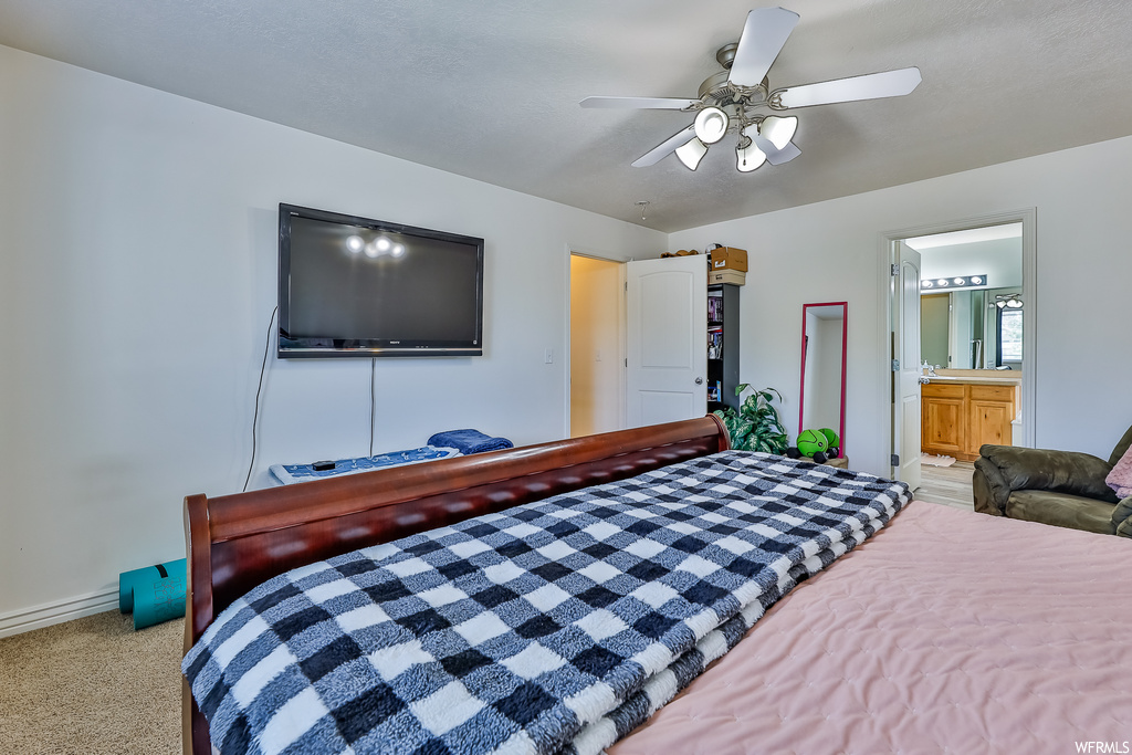 Bedroom featuring light carpet and ceiling fan