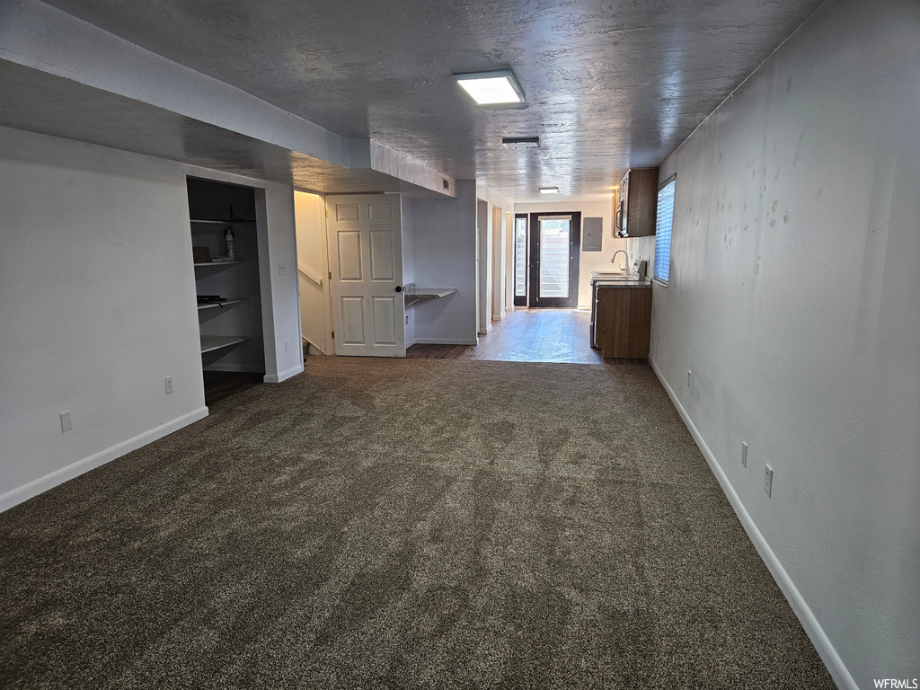 Interior space featuring dark carpet