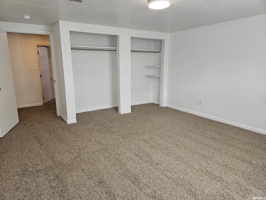 Bedroom with light carpet