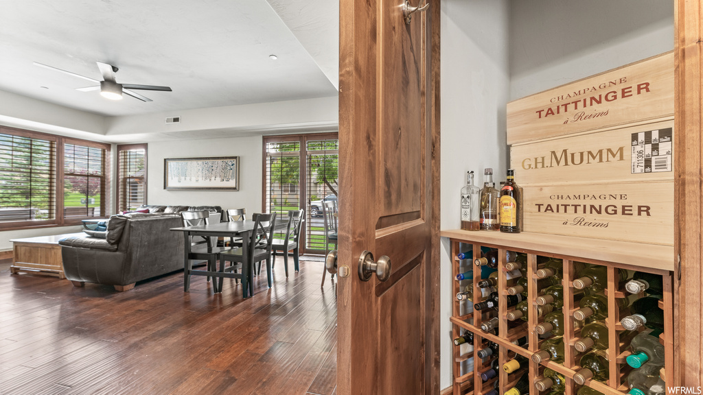 Wine room featuring ceiling fan and light hardwood flooring