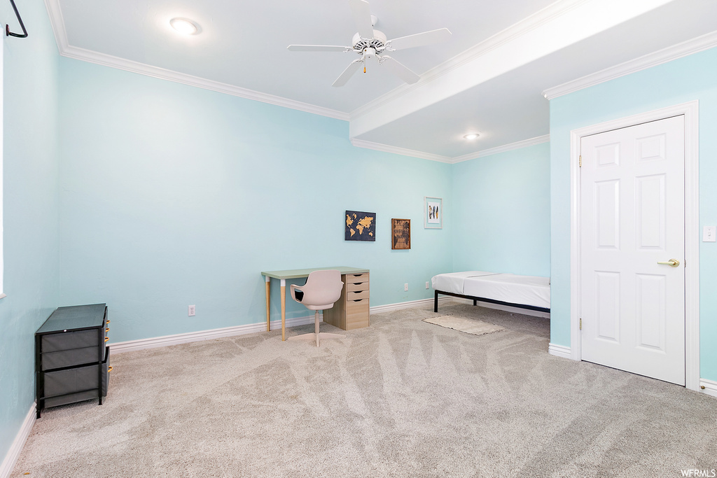 Interior space with ceiling fan and crown molding