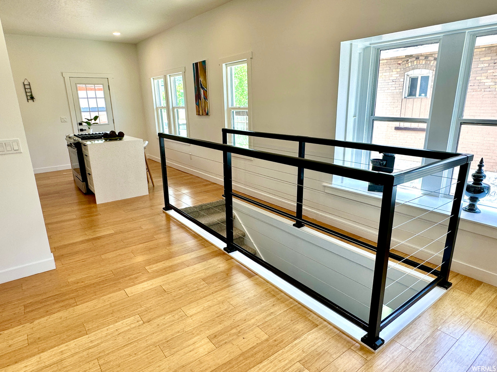 Corridor featuring light hardwood flooring