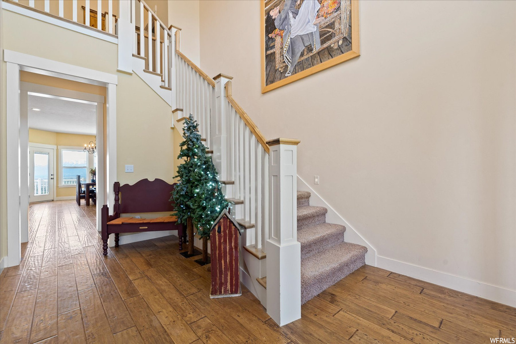 Stairs with light hardwood flooring