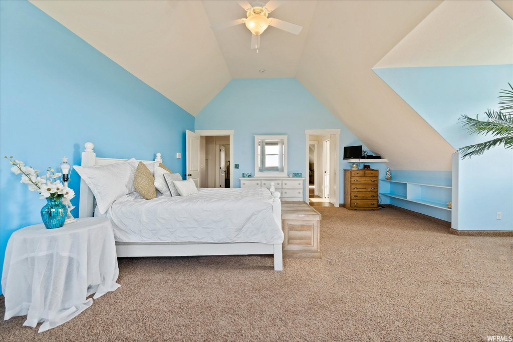 Bedroom featuring ceiling fan, light carpet, and lofted ceiling
