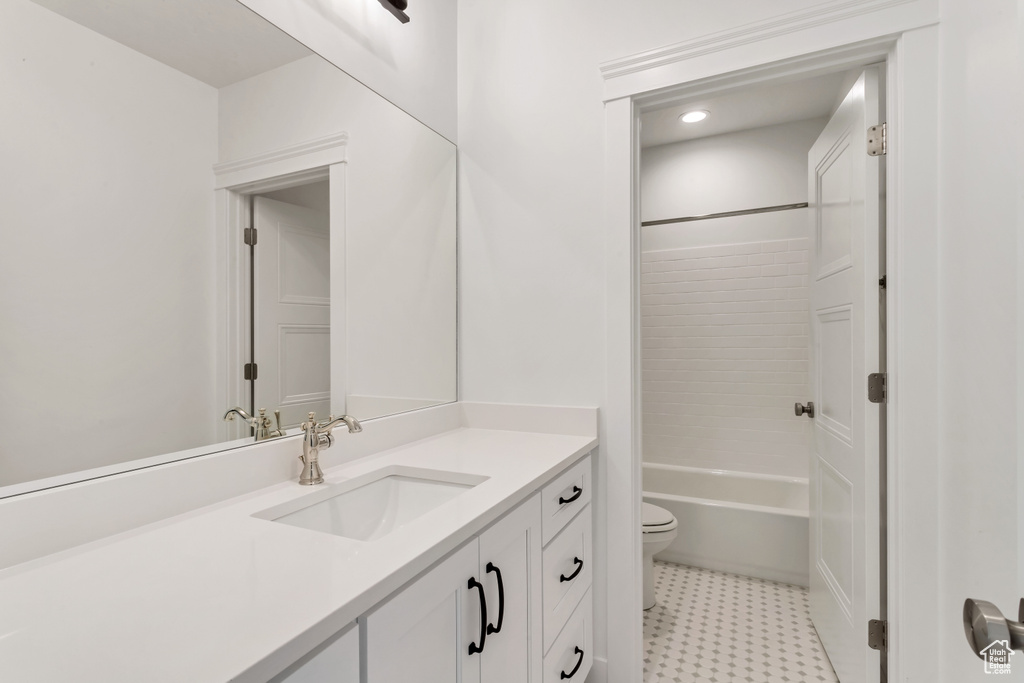 Full bathroom with vanity, tile flooring, shower / bathtub combination, and toilet