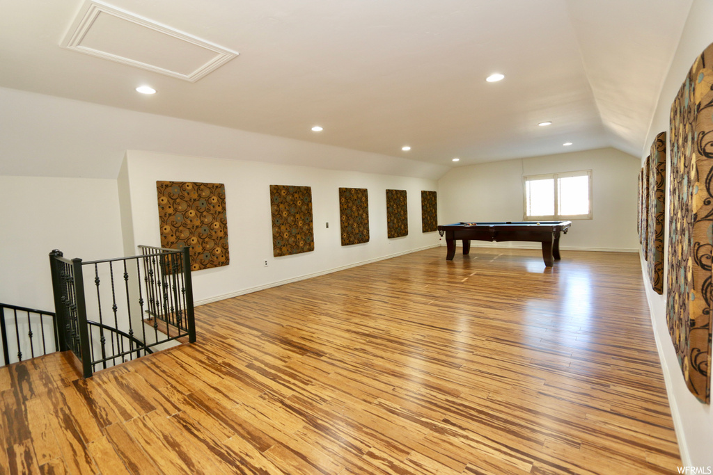 Rec room featuring lofted ceiling and light hardwood flooring