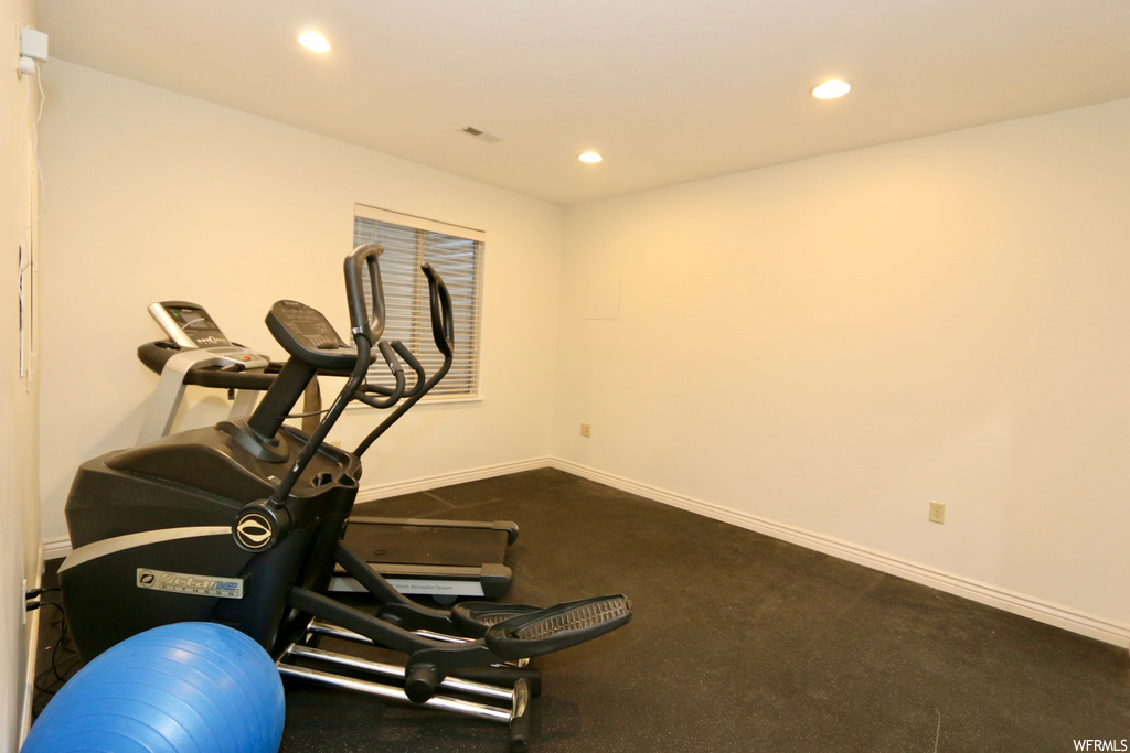 Workout room with carpet flooring