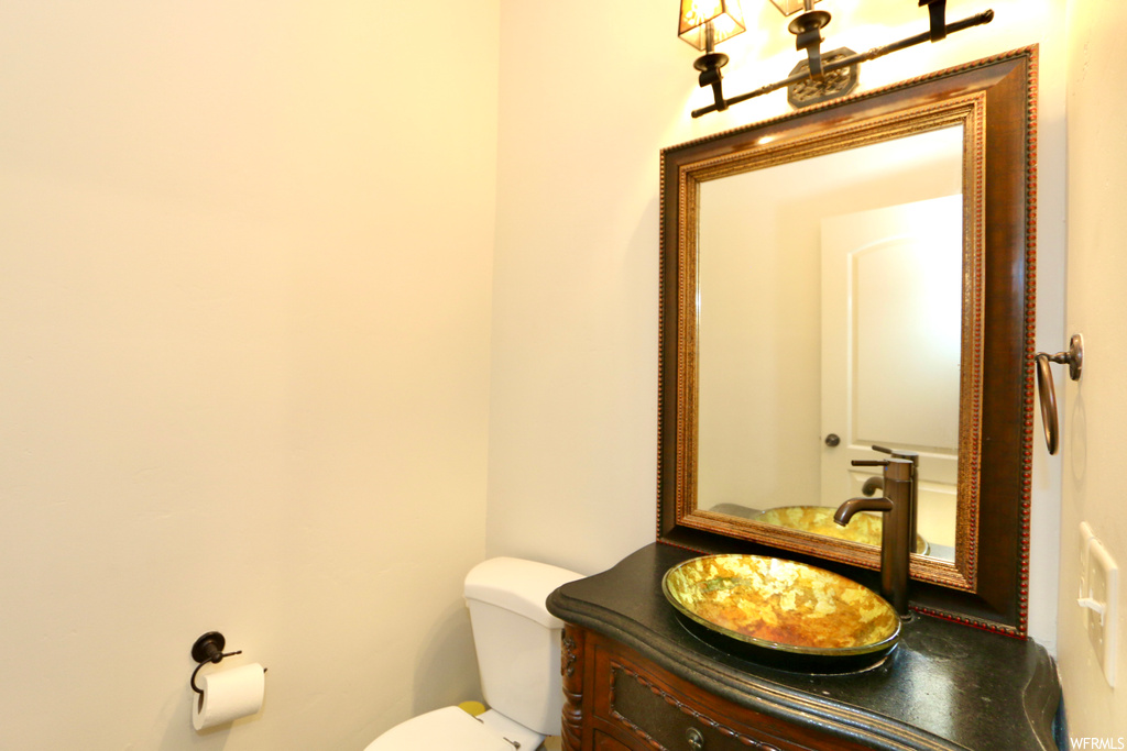 Bathroom featuring mirror and vanity