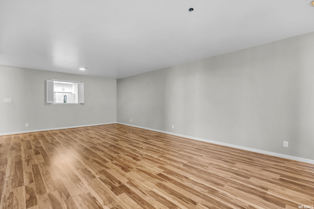 Unfurnished room featuring light hardwood floors