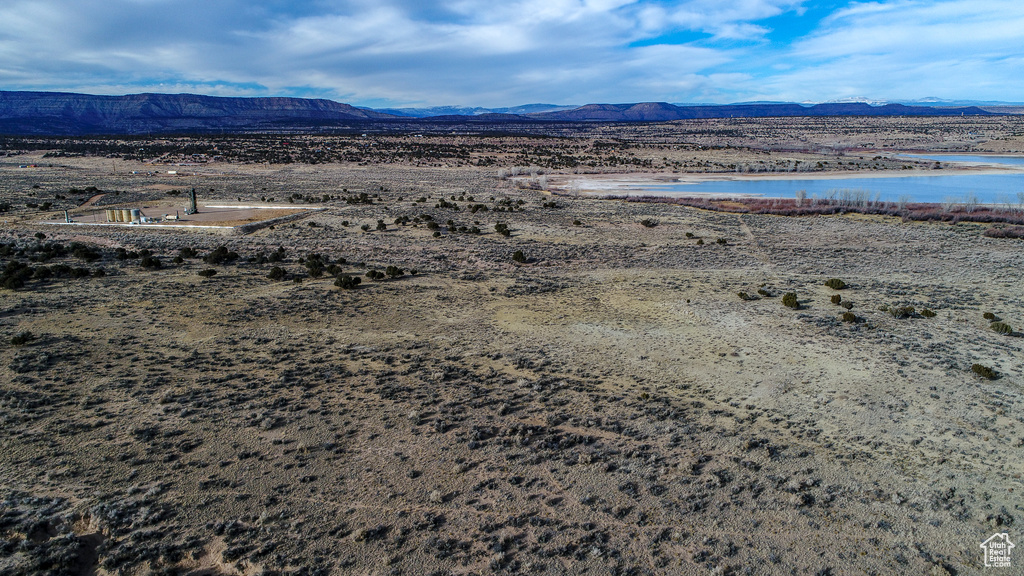 Aerial view featuring a water and mountain view