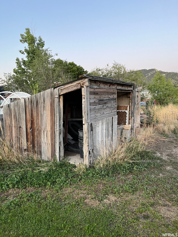 View of outdoor structure with a shed
