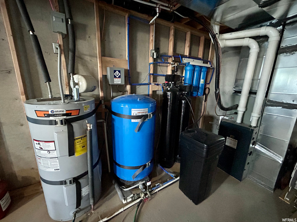 Utility room featuring electric water heater