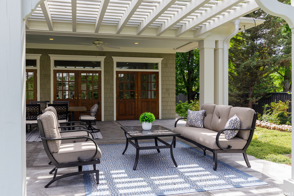 View of patio with a pergola, an outdoor living space, and french doors
