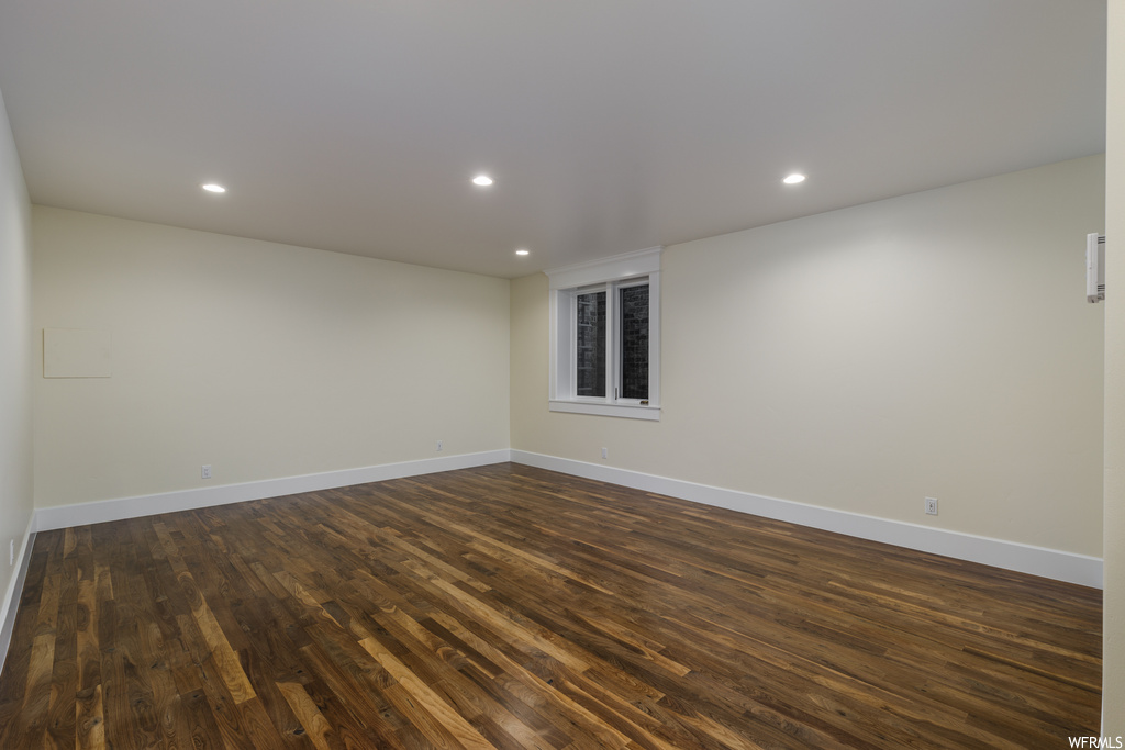 Empty room with dark hardwood floors