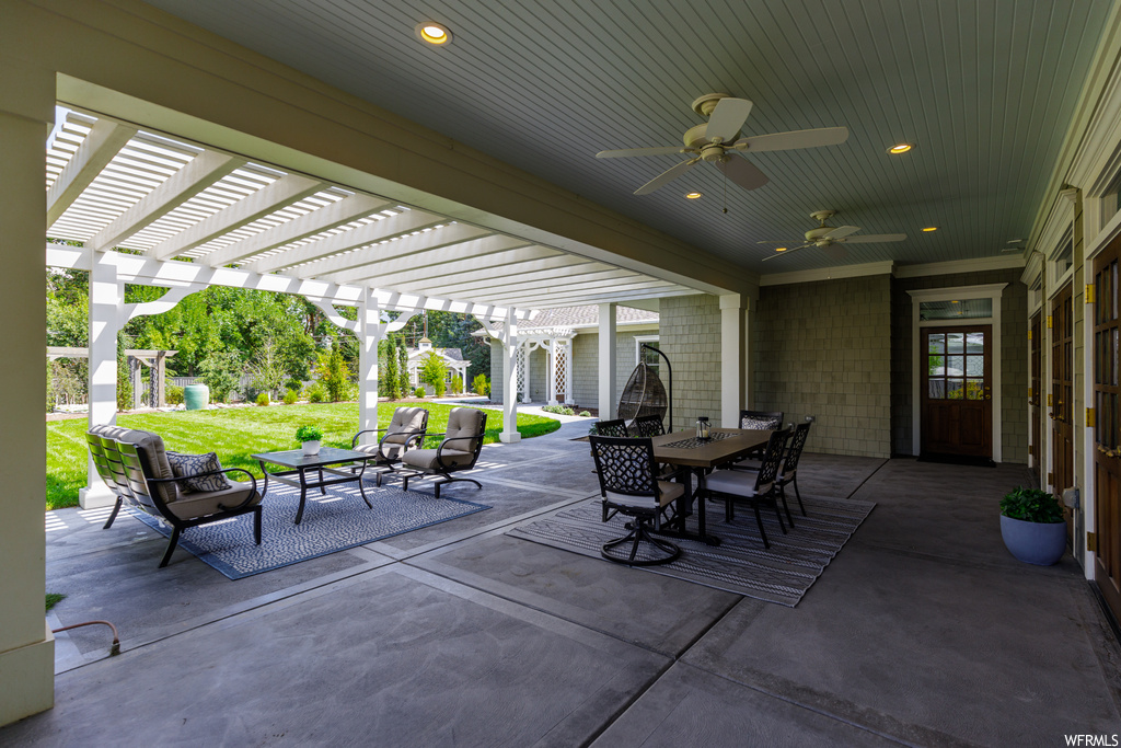 View of patio with a pergola and ceiling fan