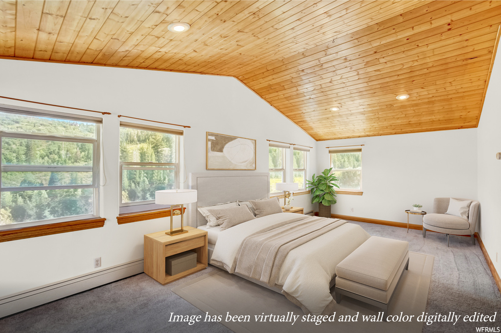 Carpeted bedroom with multiple windows, lofted ceiling, baseboard heating, and wood ceiling