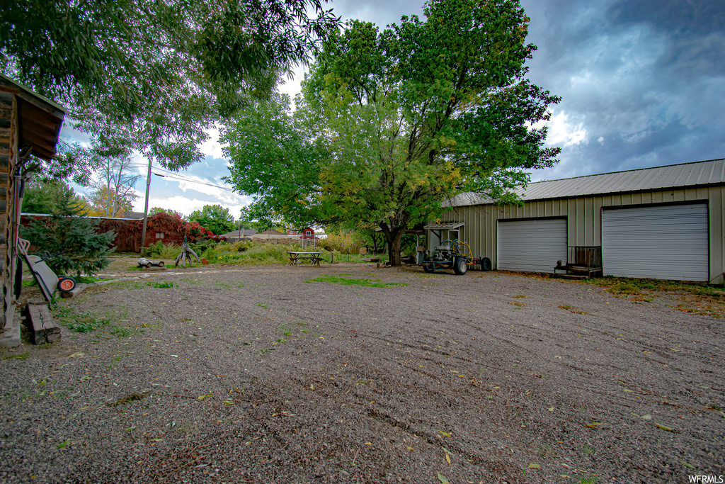 View of yard featuring a garage