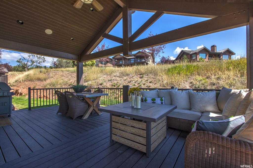 Wooden deck with an outdoor living space