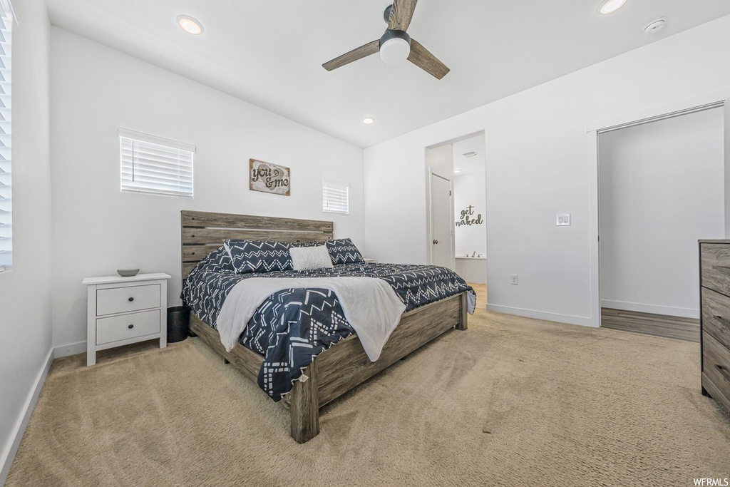 Bedroom with light carpet and ceiling fan