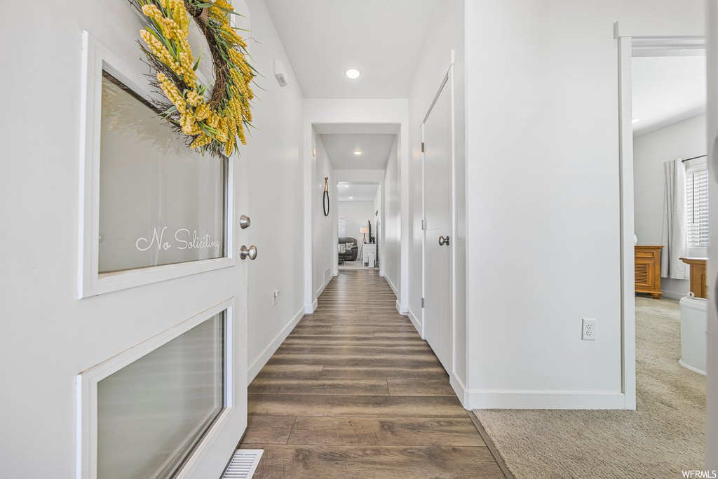 Hallway with light hardwood flooring