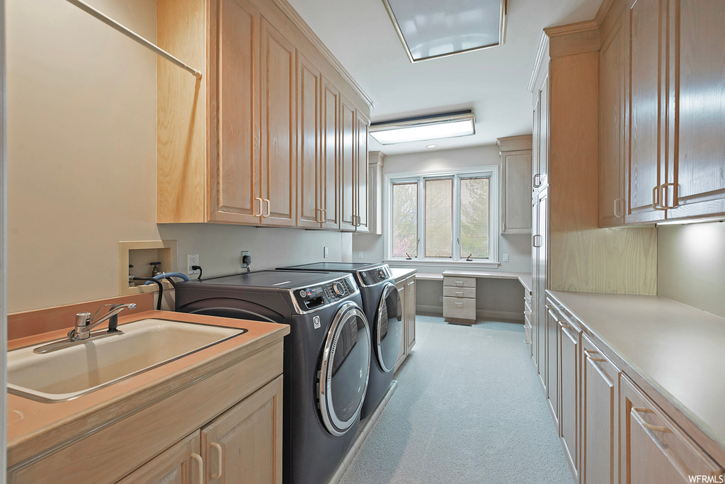 Laundry area with independent washer and dryer and light carpet