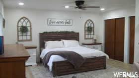 Bedroom featuring light hardwood floors and ceiling fan