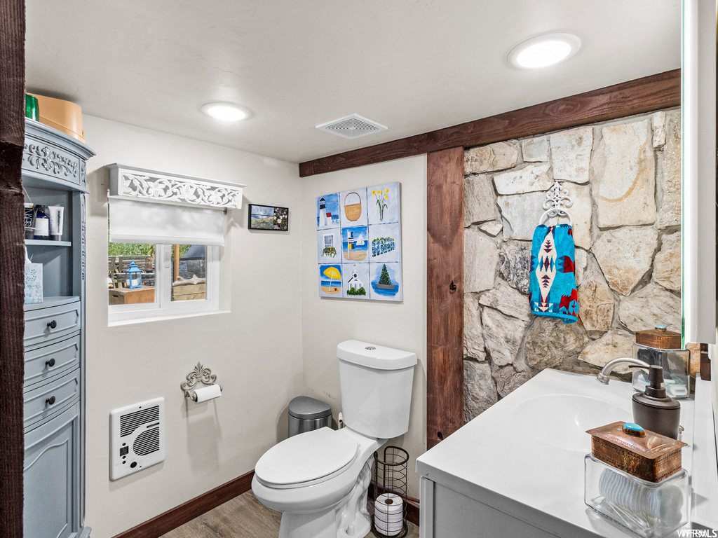 Bathroom with vanity and hardwood flooring