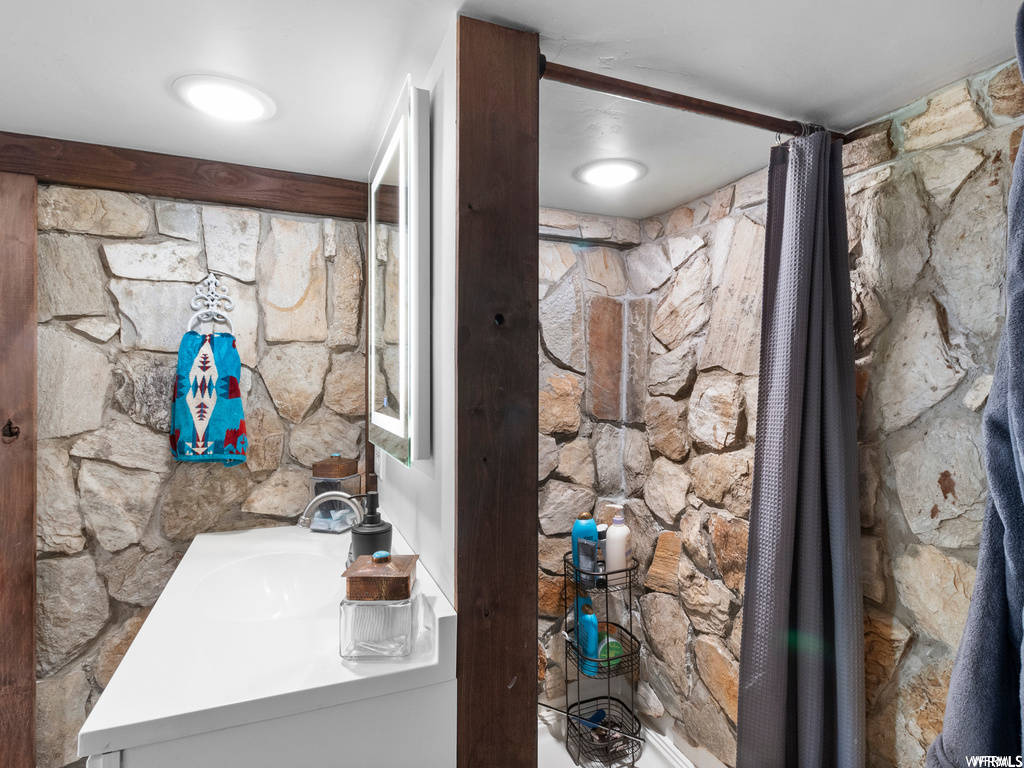 Bathroom featuring vanity and mirror