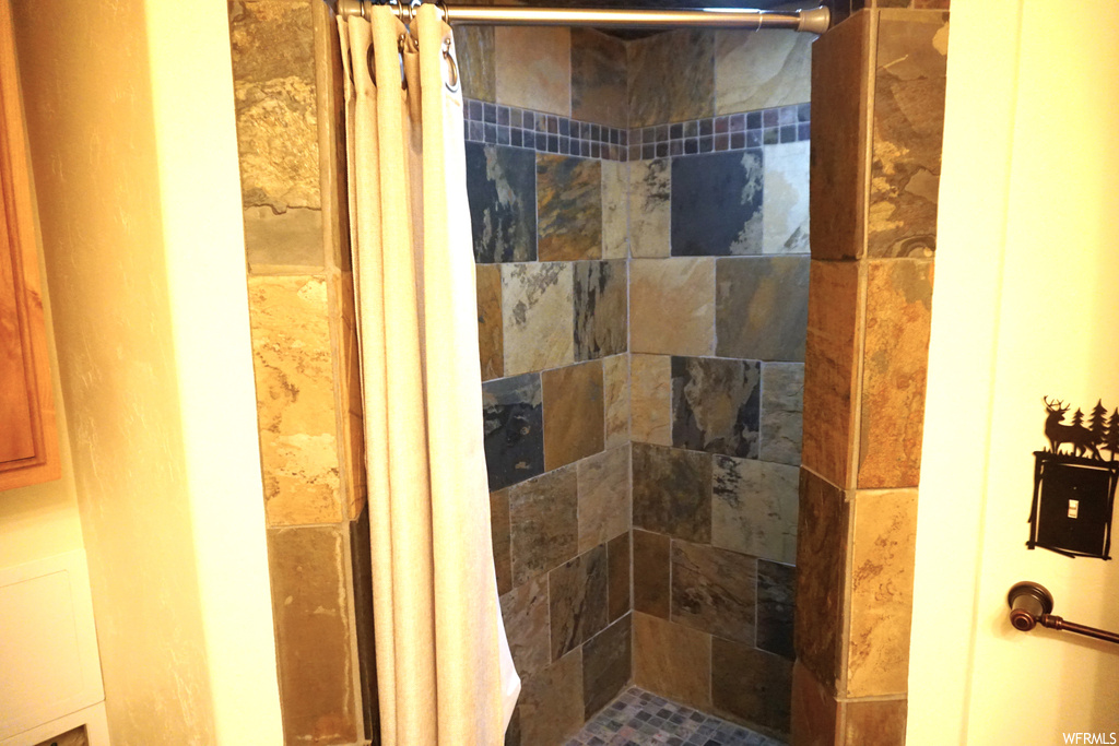 Bathroom with curtained shower