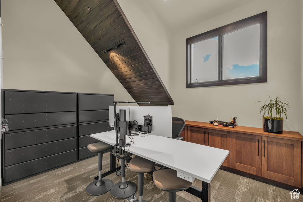 Office space featuring wooden ceiling and lofted ceiling
