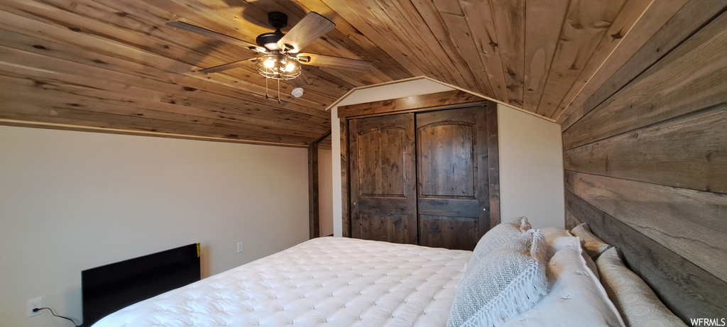 Bedroom featuring wood ceiling, vaulted ceiling, and ceiling fan