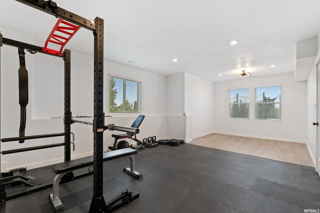 Workout area with light hardwood flooring