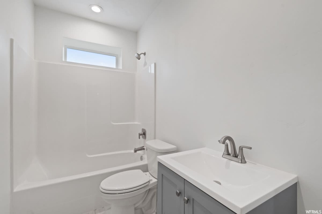 Full bathroom featuring vanity and shower / washtub combination