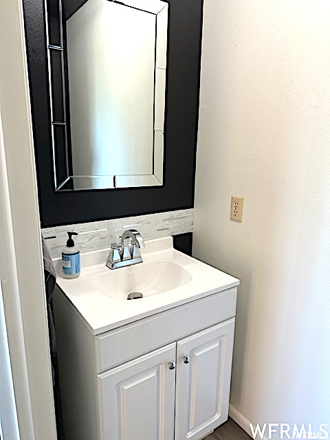 Bathroom featuring mirror and vanity
