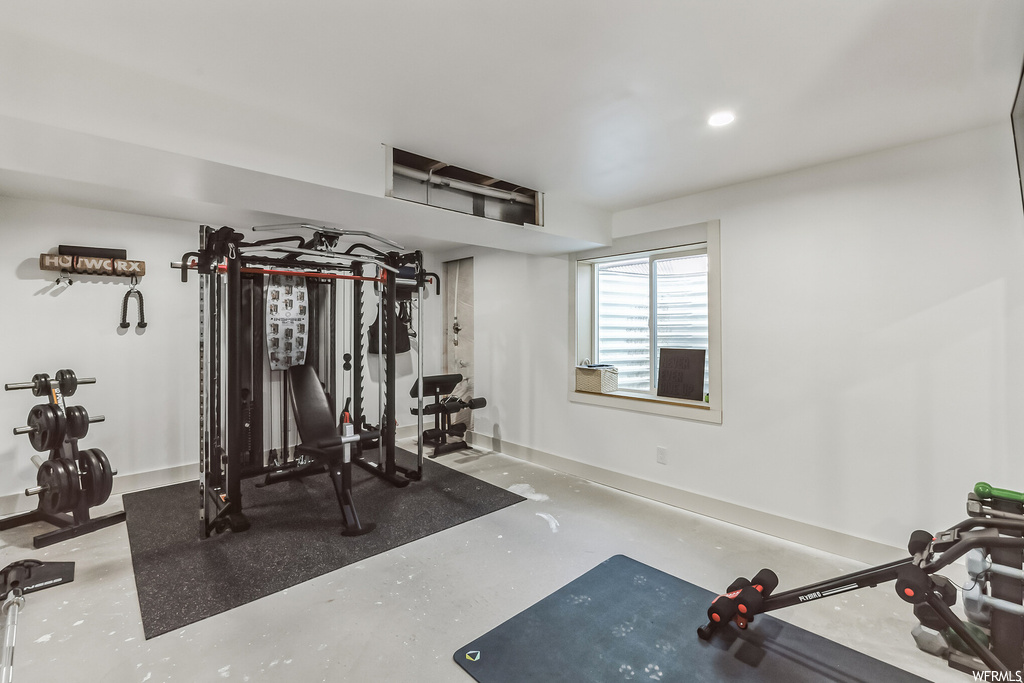 Workout room featuring concrete floors