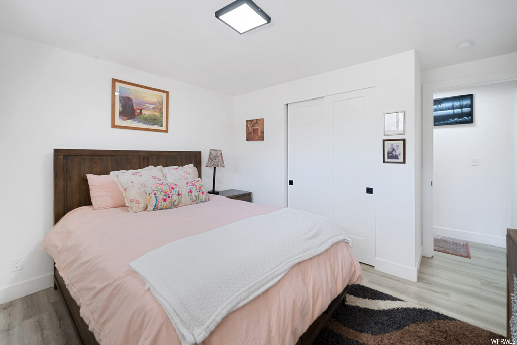 Bedroom featuring light hardwood floors