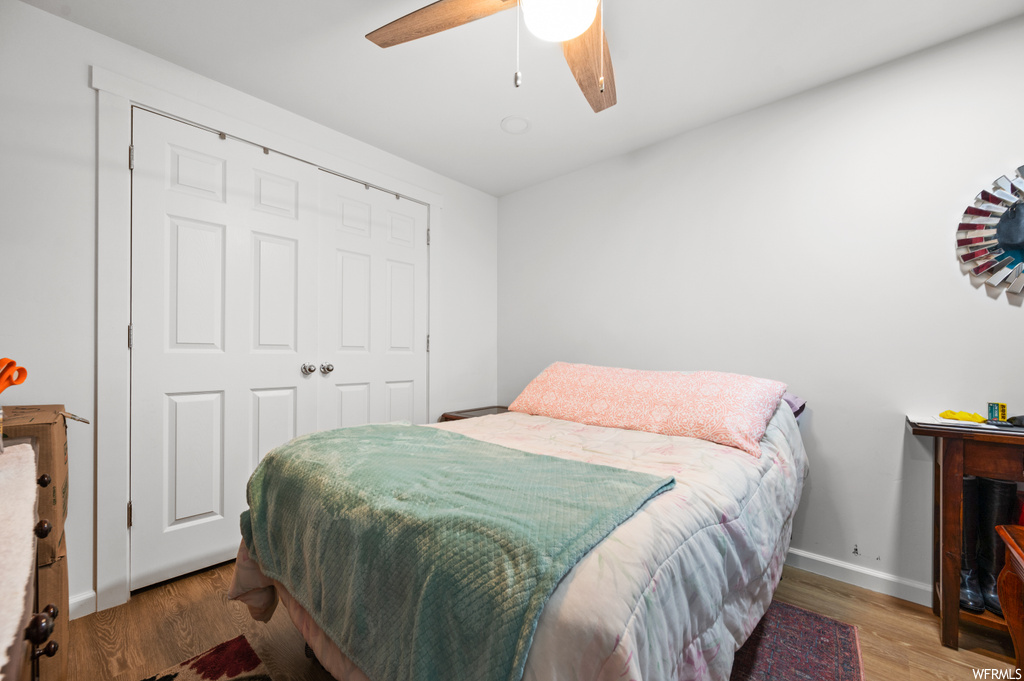 Bedroom with hardwood floors and ceiling fan