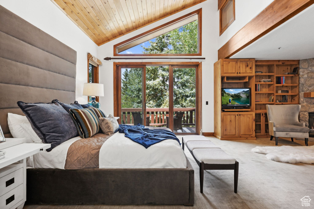 Bedroom with access to exterior, high vaulted ceiling, wooden ceiling, and carpet
