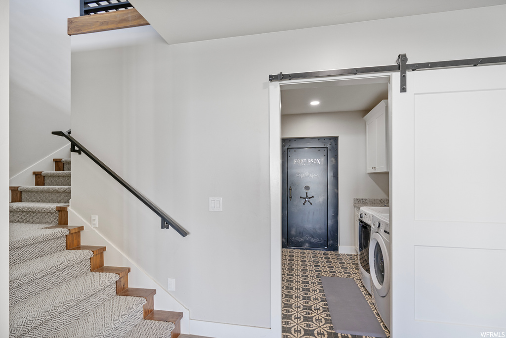 Washroom featuring tile floors and independent washer and dryer