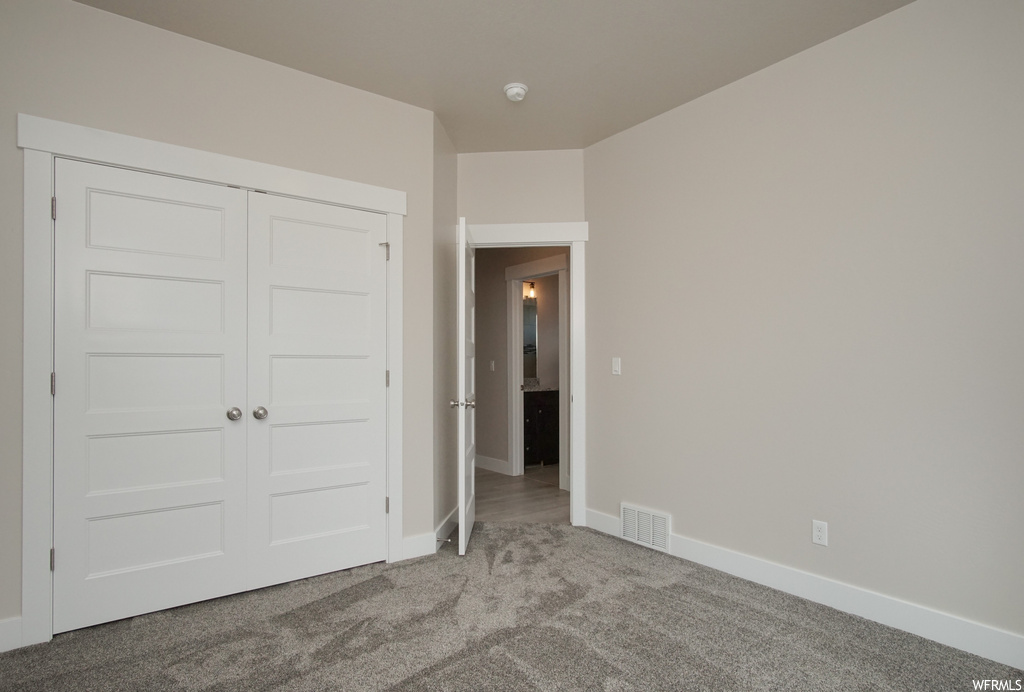 Bedroom with dark carpet