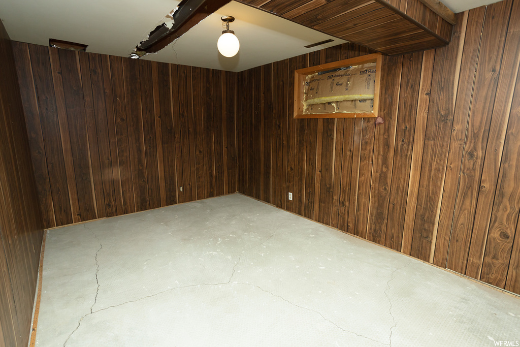 Empty room with wooden walls