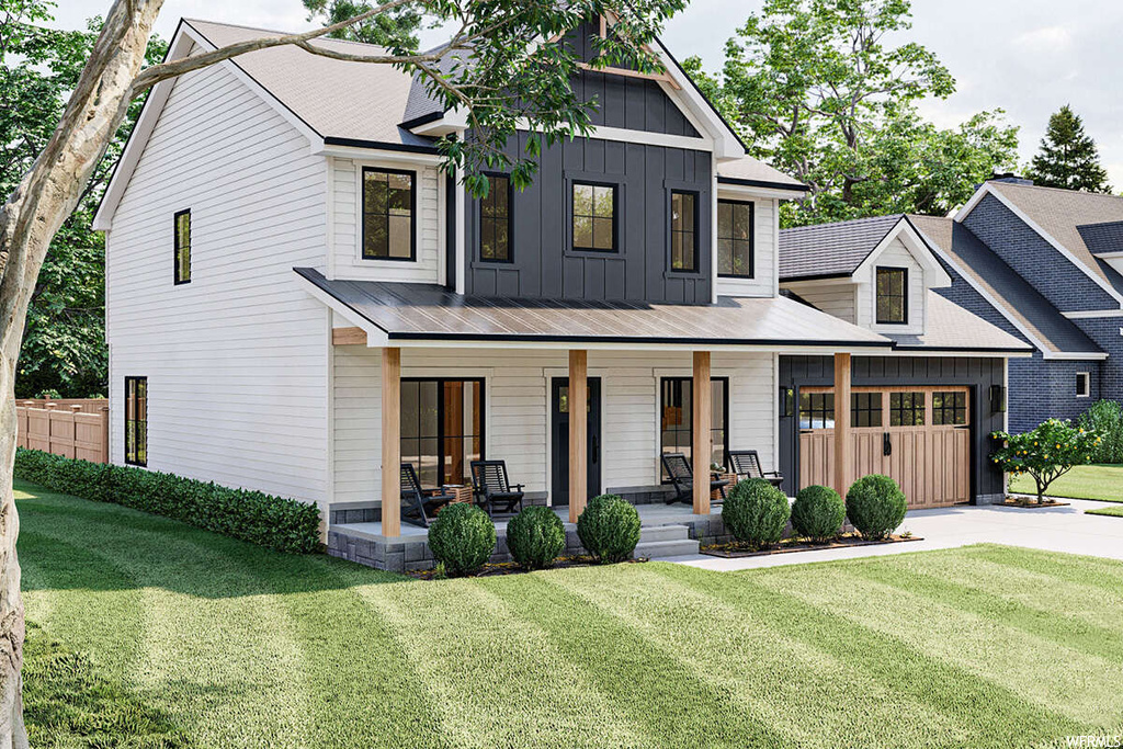 Modern inspired farmhouse featuring a porch and a front lawn