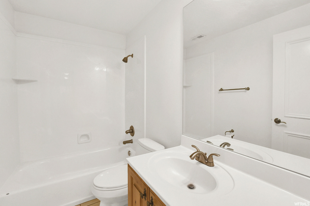 Full bathroom featuring shower / bathtub combination, oversized vanity, and mirror