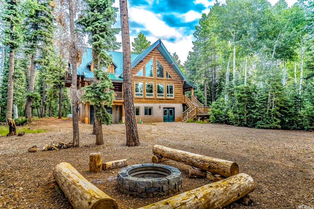 View of front of home with a firepit