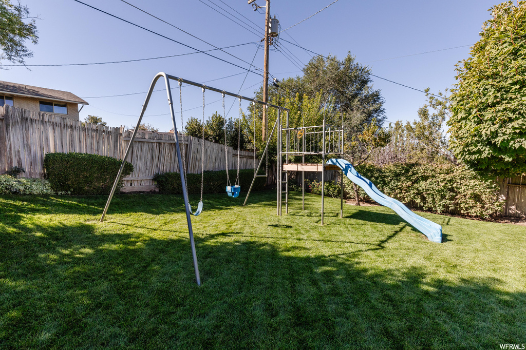 View of playground with a yard