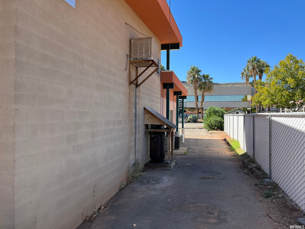 View of side of property featuring central air condition unit