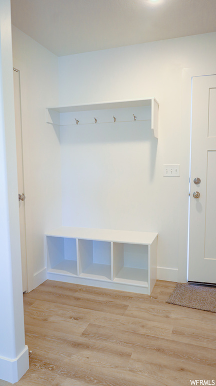 Mudroom featuring light hardwood flooring