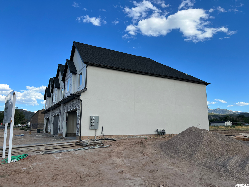 View of side of property featuring a garage