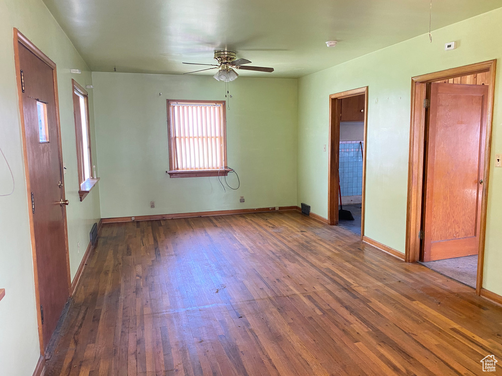 Spare room featuring ceiling fan and hardwood / wood-style floors